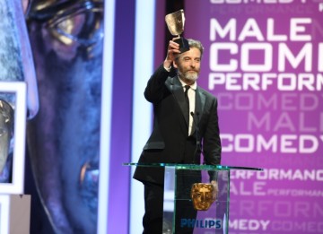 Peter Capaldi collects the Male Performance in a Comedy Role BAFTA for his hilarious portrayal of the sweary political spin doctor Malcolm Tucker in The Thick Of It. (BAFTA/Steve Butler)