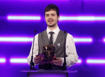 The newest Blue Peter cohort and CBBC man Barney Harwood steps up to present the Family award. (Pic: BAFTA/Brian Ritchie)