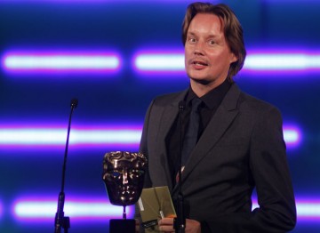 The award-winning games composer and sound designer announces the winner of Original Music. (Pic: BAFTA/Brian Ritchie)