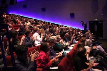 The audience applaud Bovell following his remarkable screenwriters' lecture.