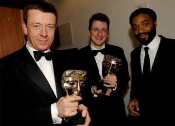 Chiwetel Ejiofor (right) with Peter Morgan and Jeremy Brock, winners of the BAFTA for Adapted Screenplay for The Last King of Scotland (BAFTA / Liam Daniel).