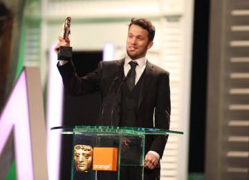 Michael Please accepts the BAFTA for his animation The Eagleman Stag. (Pic: BAFTA/Stephen Butler)