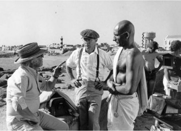 Producer/Director Richard Attenborough talks to actor Ben Kingsley on location in India