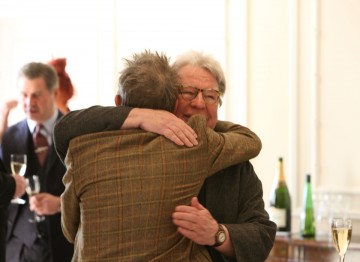 John Hurt greets Alan Parker. The two worked together on Midnight Express which Parker directed in 1978. 