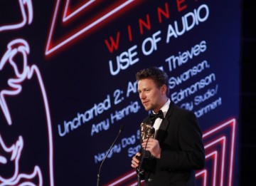 Christophe Balestra accepts the second award of the eventing for Uncharted 2: Among Thieves, winner in the Use of Audio category (BAFTA/Brian Ritchie)