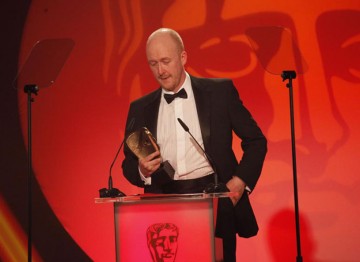 Dan Jones accepts the award for his music composed to accompany the four part television series, Any Human Heart. (Pic: BAFTA/Jamie Simonds)