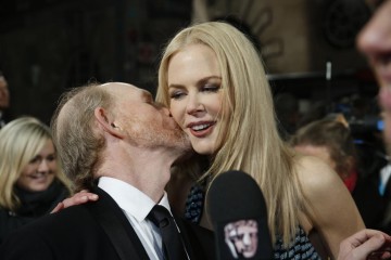 Ron Howard gives fellow nominee Nicole Kidman a kiss
