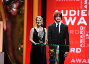Gavin and Stacey's Joanna Page and YouTube sensation Charlie Mcdonnell present the YouTube Audience BAFTA to The Inbetweeners. (BAFTA/Steve Butler)