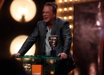 Mickey Rourke struggles to see the teleprompter as he introduces the category for Leading Actress (BAFTA/Brian Ritchie).