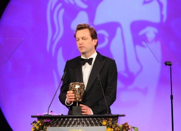 Philip Martin completes a hat-trick of mask for Mo as he collects the Director Fiction BAFTA.