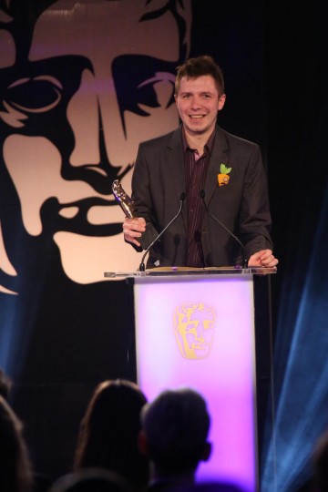 A member the development team behind The Vanishing of Ethan Carter accepts the award for Game Innovation at the British Academy Games Awards in 2015