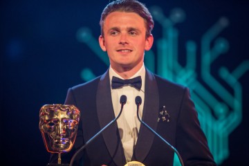 Actor Lewis Reeves presents the award for Narrative