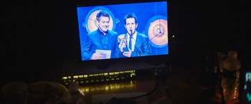 Dick & Dom present the Game award, as seen from the monitor backstage