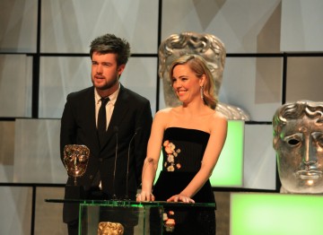 Jack Whitehall and Melissa George accepted Graham Norton's BAFTA Entertainment Performance in his absence.