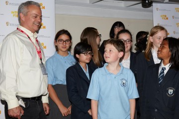 Director, editor Mark Solomon with students from St Michael's Catholic School