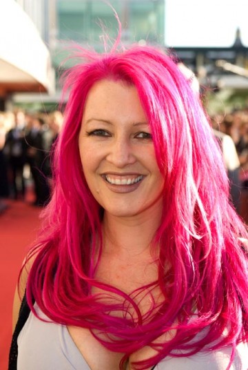 Jane Goldman sported her trademark pink hair on the red carpet as she arrived with husband and Entertainment Performance nominee Jonathan Ross (BAFTA / Richard Kendal).