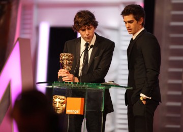 The Social Network co-stars Jesse Eisenberg and Andrew Garfield accept David Fincher's BAFTA on his behalf. " I know David would first and foremost want to thank Aaron Sorkin for his incredible screenplay, which is as exhilarating to read as it is to perf