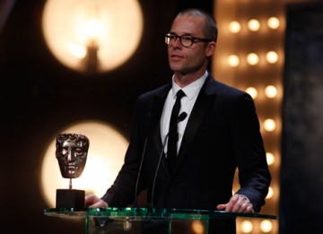 Actor Guy Pearce presents the award for Adapted Screenplay (BAFTA/Brian Ritchie).