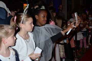 Children getting red carpet ready in Monsoon accessories