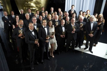 The winners of the Orange British Academy Film Awards in 2008 display their masks with pride (pic: BAFTA / Camera Press).