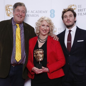 Sam Claflin, Stephen Fry and BAFTA Chair Anne Morrison pose for photos after announcing the nominations for the EE British Academy Film Awards in 2015