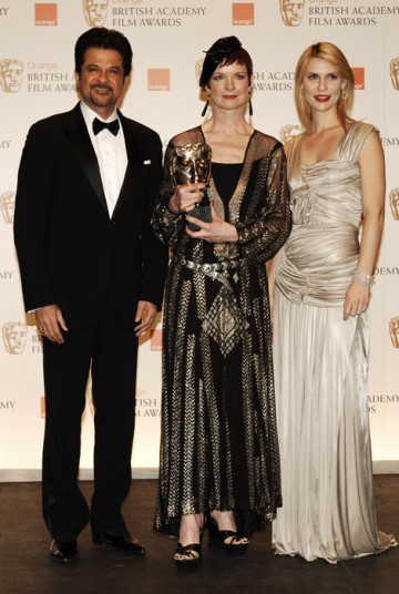 Winner of best Costume Design award, Sandy Powell, stands with presenters Anil Kapoor and Claire Danes (BAFTA/Richard Kendal)