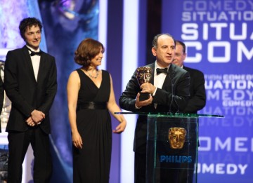 The Thick of It creater Armando Iannucci and cast collect the Situation Comedy award for their political BBC hit. (BAFTA/Steve Butler)
