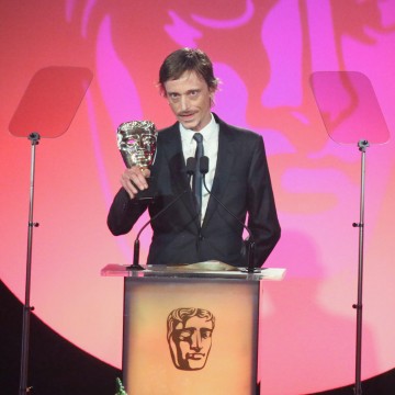 Mackenzie Crook accepts the award for Writer: Comedy at the British Academy Television Craft Awards in 2015