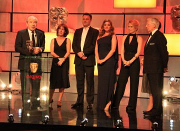 The winning team, including Lord  Sugar, Nick Hewer, Karen Brady, Michele Kurland, Colm Martin, Darina Healy and Andy  Devonshire.