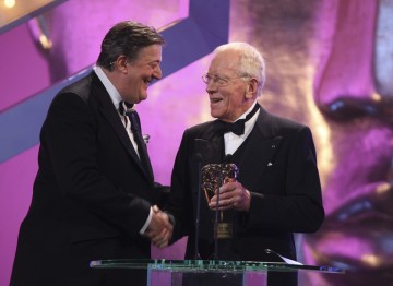 Stephen Fry hands over to Max von Sydow who presented this year's Fellowship.