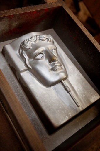 Once filled with the bronze alloy the moulds take about forty minutes to cool down (BAFTA / Marc Hoberman).