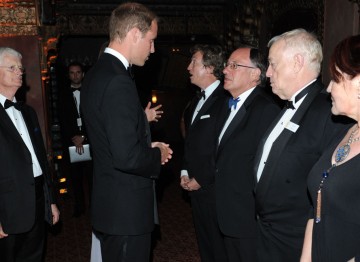 BAFTA Chairman Tim Corrie watches on as the Duke of Cambridge greets Nigel Lythgoe, John Willis, Brian Walton and Rebecca Segal