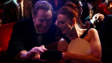 Bryan Cranston and Julianne Moore take a selfie whilst waiting for the ceremony to begin