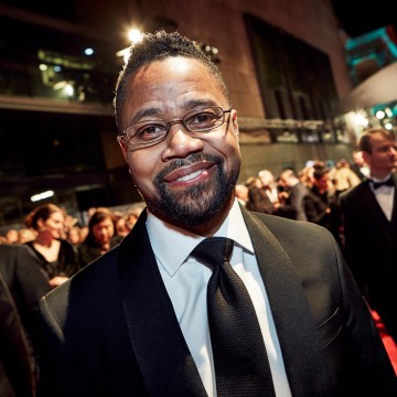Presenting the award for Original Screenplay, Cuba Gooding Jr smiles for the camera on the red carpet