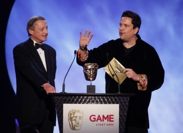 Comedian Dom Joly presents the award for best Strategy game along with Chris Deering, President of Sony Computer Entertainment Europe (BAFTA/Brian Ritchie)