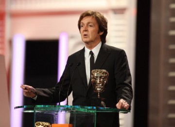 Sir Paul McCartney presented the Original Music BAFTA and joked "If I find my music is being used in a movie, I personally ring up the director to let him know how much I’m suing him for.” (Pic: BAFTA/Stephen Butler)