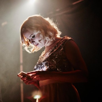 Red carpet host Katie Thistleton checks her phone backstage at the British Academy Children's Awards in 2015