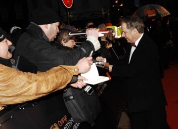 Legendary animator Nick Park signs autographs for Wallace and Gromit fans on the red carpet (BAFTA / Richard Kendal).