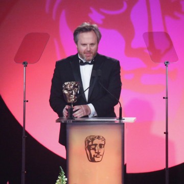 Yan Miles accepts the award for Editing: Fiction at the British Academy Television Craft Awards in 2015