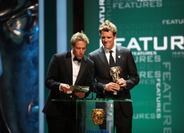 Olympic rowing champion James Cracknell and presenter and advernturer Ben Fogle present the Academy Award for Features. (BAFTA/Steve Butler)