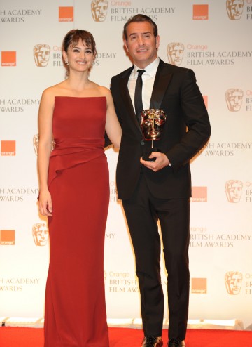 Presenter Penelope Cruz with the French actor who won for his performance as silent movie star George Valentin in The Artist.