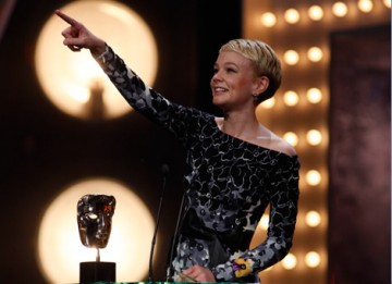 Carey Mulligan acknowleges her father and brother in the audience as she gives her acceptance speech for the Leading Actress award for her performance in An Education (BAFTA/Brian Ritchie).