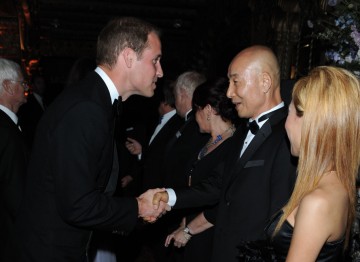 The Duke of Cambridge greets Mr. and Mrs.Kim, owners of the Belasco Theatre