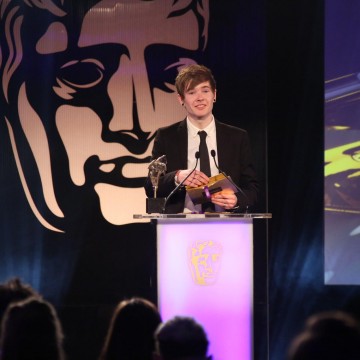 Dan Middleton presents the Ones to Watch Award at the British Academy Games Awards Ceremony in 2015