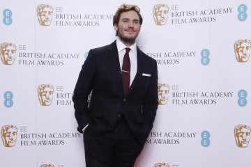Sam Claflin poses for photos after announcing the nominations for the EE British Academy Film Awards in 2015
