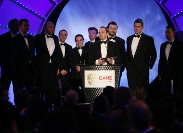 The team at Rocksteady Studios, creators of Batman: Arkham Asylum, take to the stage for the second time in the evening to accept the coveted award of Best Game (BAFTA/Brian Ritchie)