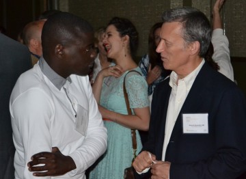 Background; Jessica Brown Findlay with Daniel Kaluuya talking with Duncan Kenworthy in the forefront
