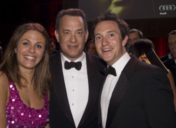 Tom Hanks poses with guests at the Brits to Watch party