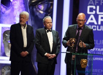 The Dispatches team behind Terror in Mumbai, including Dan Reed and Eamonn Matthews, collect the Current Affairs BAFTA . (BAFTA/Steve Butler)