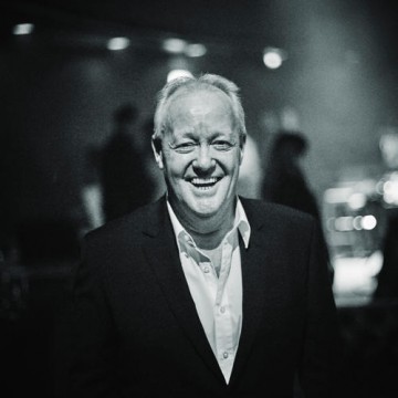 Former ceremony host Keith Chegwin smiles backstage